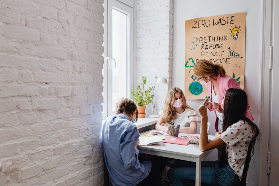 A teacher instructs teenagers on environmental conservation in a classroom setting
